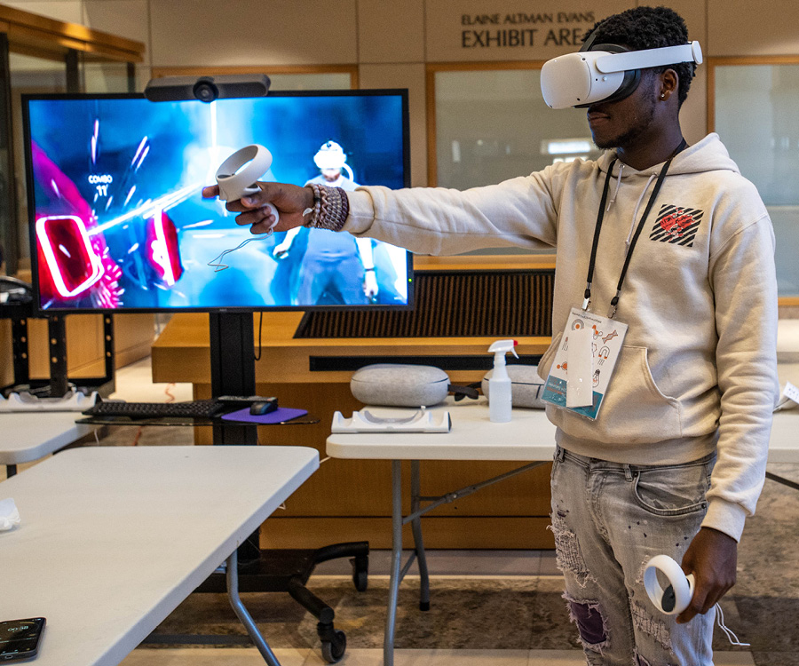 Student tries out a virtual reality headset at the 2023 Big Orange STEM Saturday.