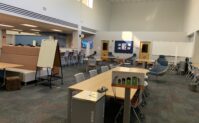 Tables that can accommodate groups of 2, 4, or ten. There are soft lounge chairs and booth style seats.
