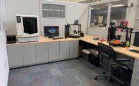 Makerspace area in Pendergrass Library. On the left there is the uPrint professional grade 3D printer. To the right, there are two Taz Lulzbot 6 printers.